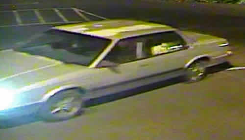 Gray car with headlights on (JPG)